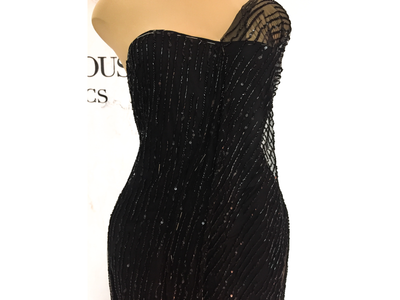 rows of black beads handmade lace on dress form | Glam House Fabrics